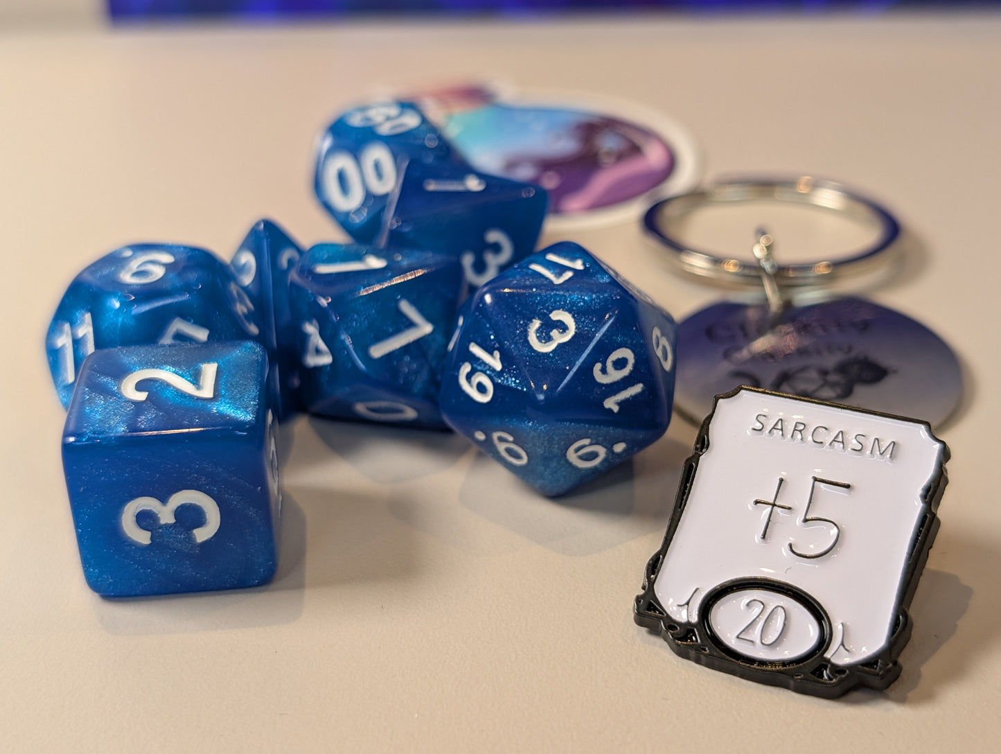 Blue Dice Pack – Polyhedral Dice Set with Sticker, Keyring, and Badge!