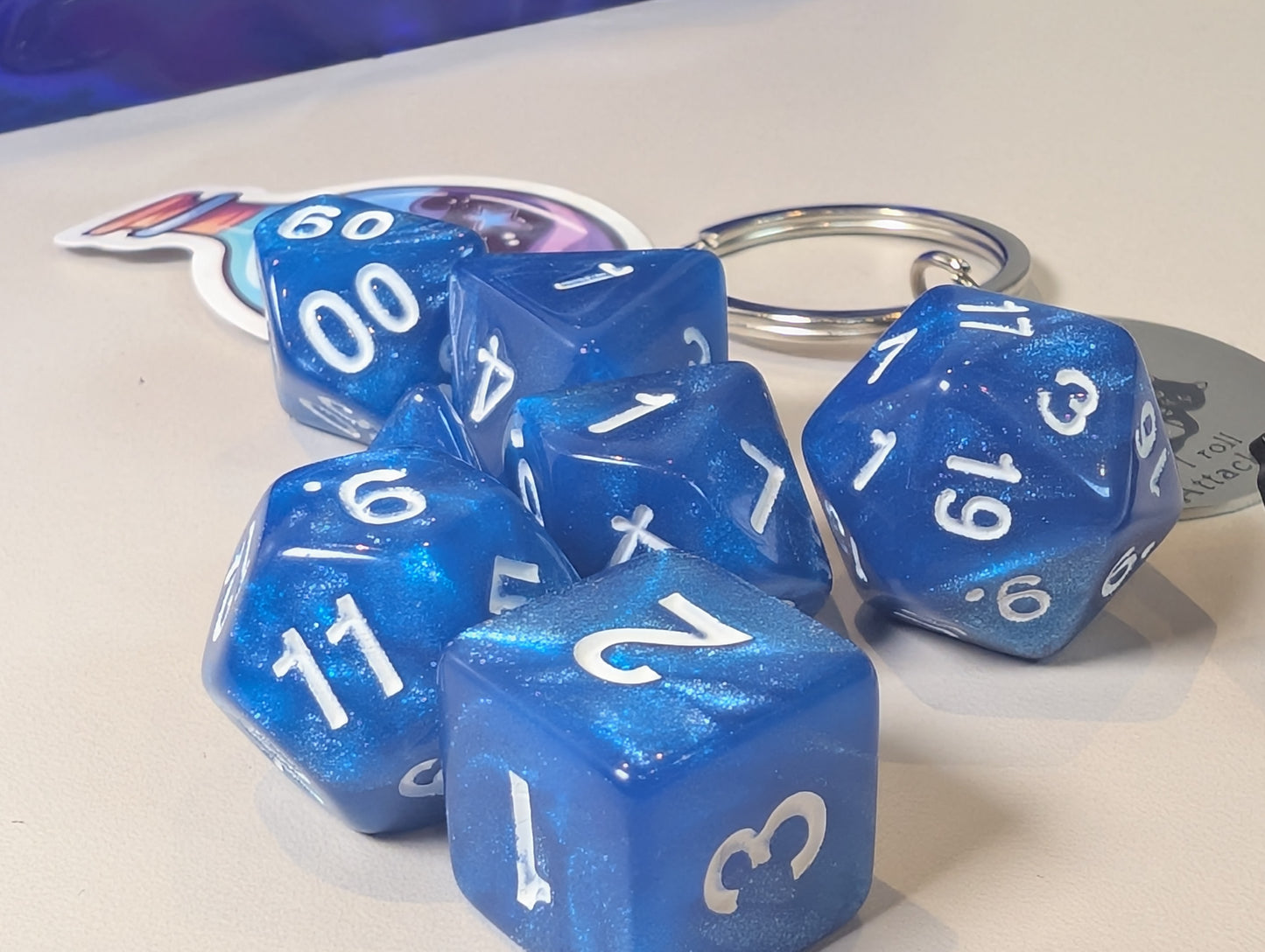 Blue Dice Pack – Polyhedral Dice Set with Sticker, Keyring, and Badge!
