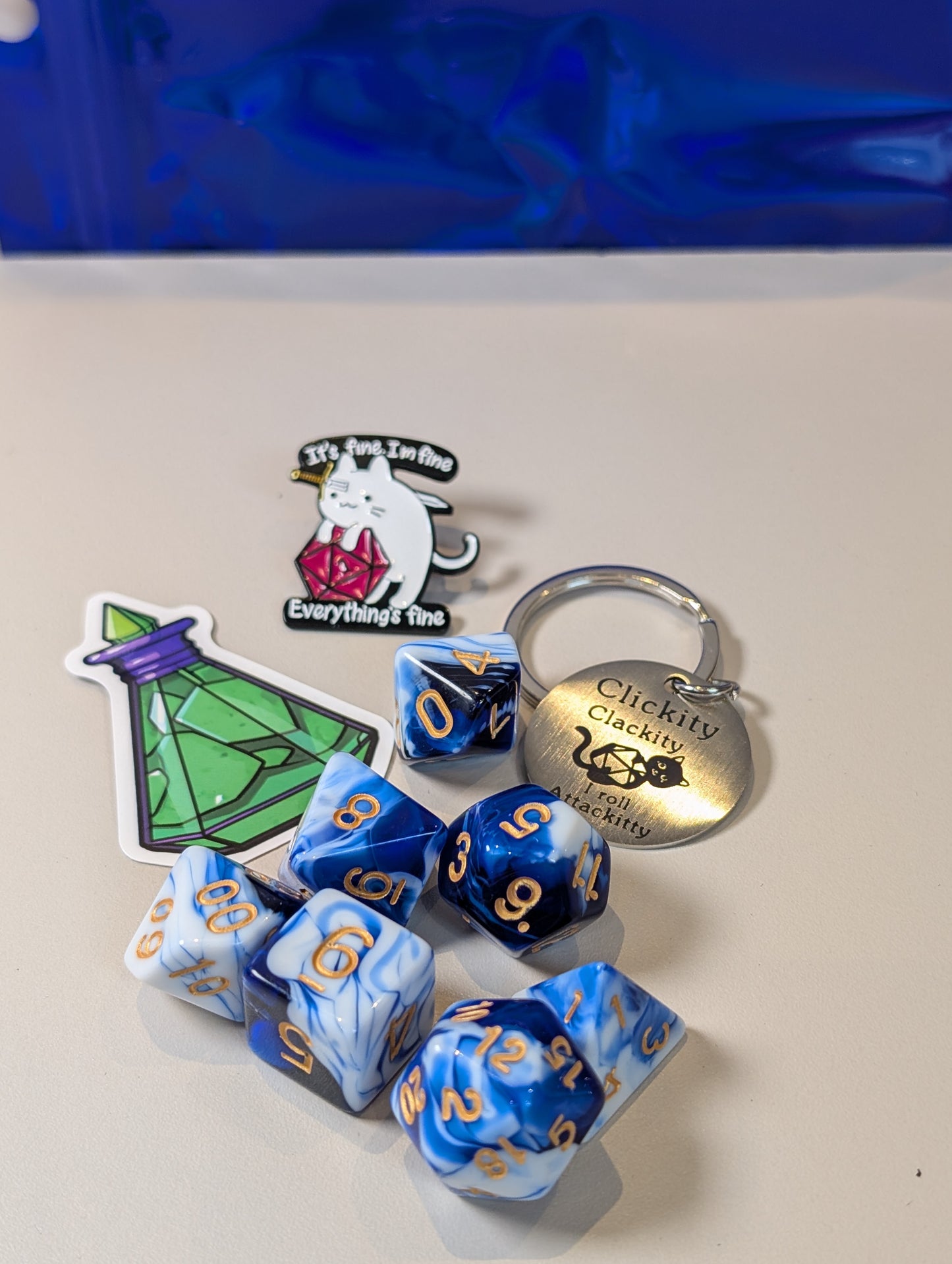 Blue & white Dice Pack – Polyhedral Dice Set with Sticker, Keyring, and Badge!