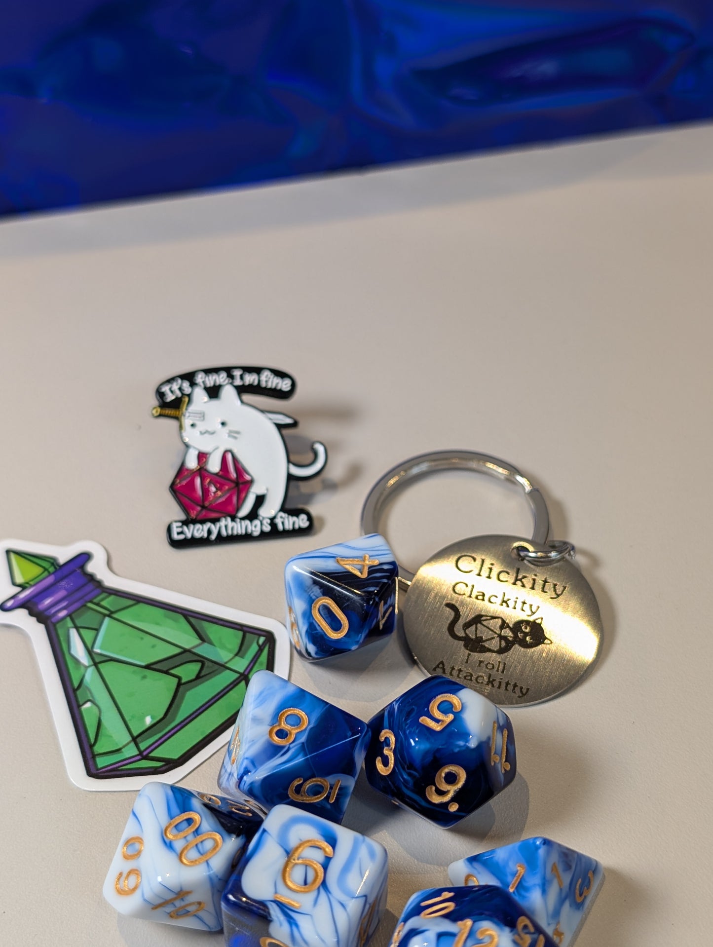 Blue & white Dice Pack – Polyhedral Dice Set with Sticker, Keyring, and Badge!