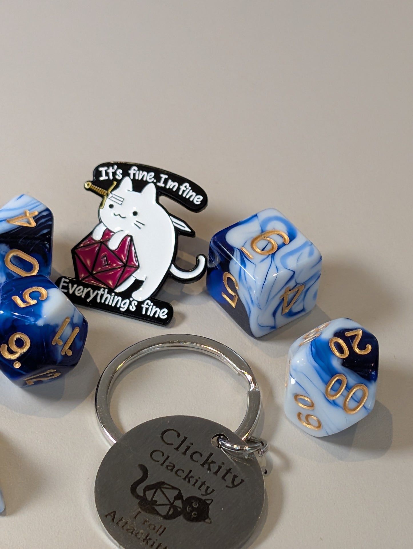 Blue & white Dice Pack – Polyhedral Dice Set with Sticker, Keyring, and Badge!