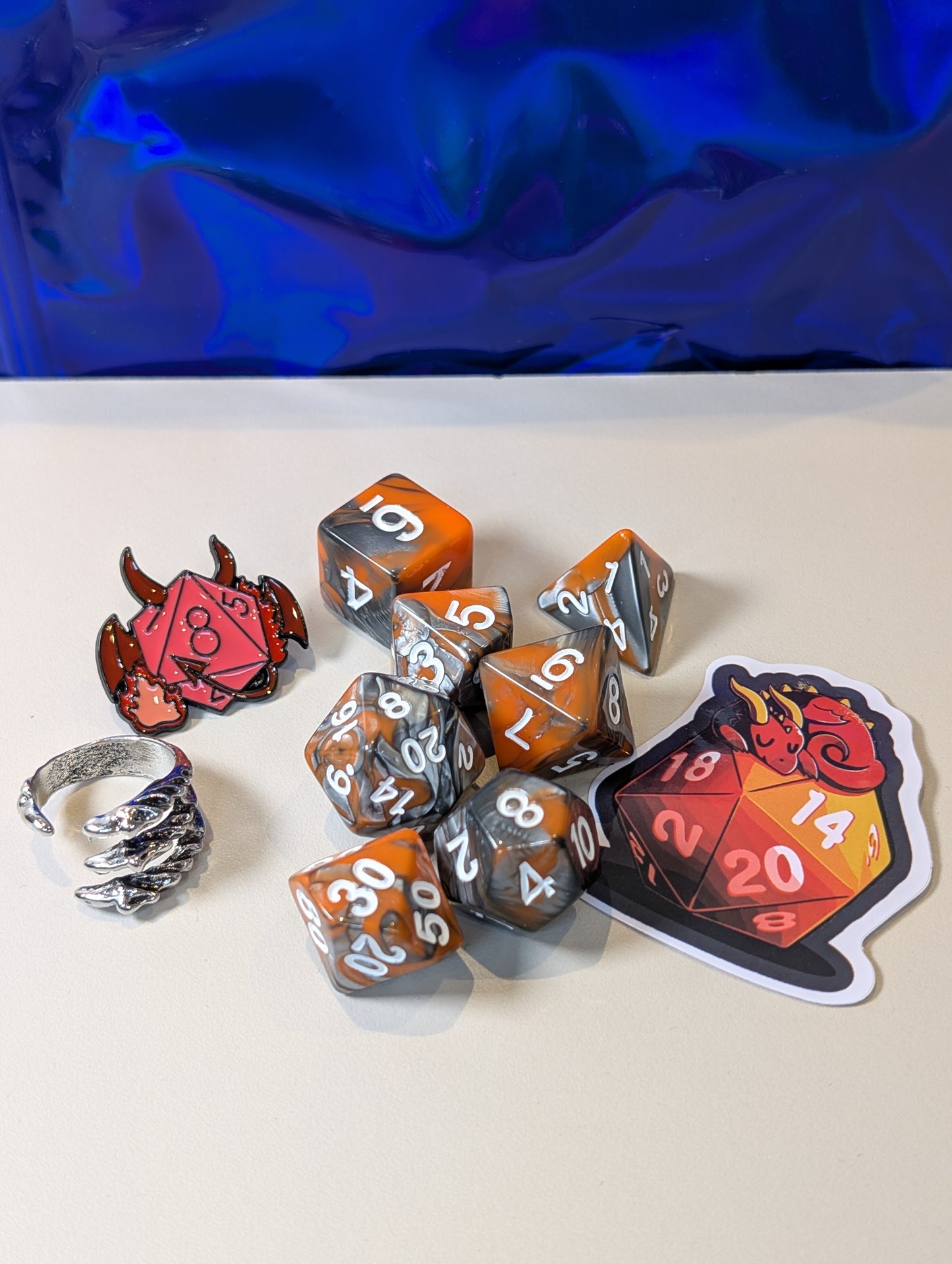 volcanic dragon Dice Pack – Polyhedral Dice Set with Sticker, ring, and Badge!