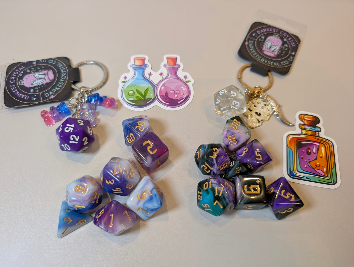 Jester’s Trick Mr J Dice Set – Purple & Green Joker-Inspired RPG Dice with Matching Keyring