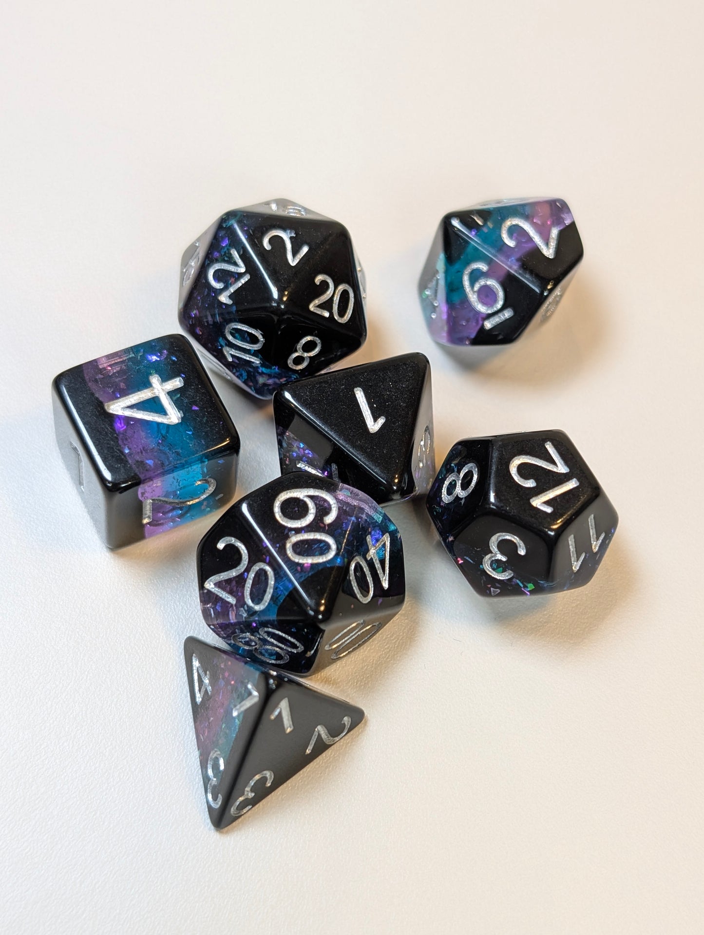 Nebula Veil Dice Set – Black Polyhedral Dice with Sparkly Purple & Blue Core