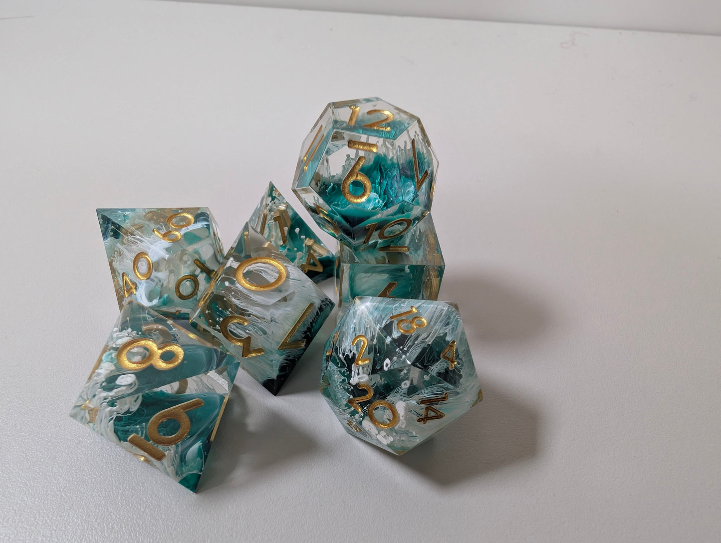 Mermaid wishes ttrpg polyhedral dice gift set, sea waves design in clam shell case
