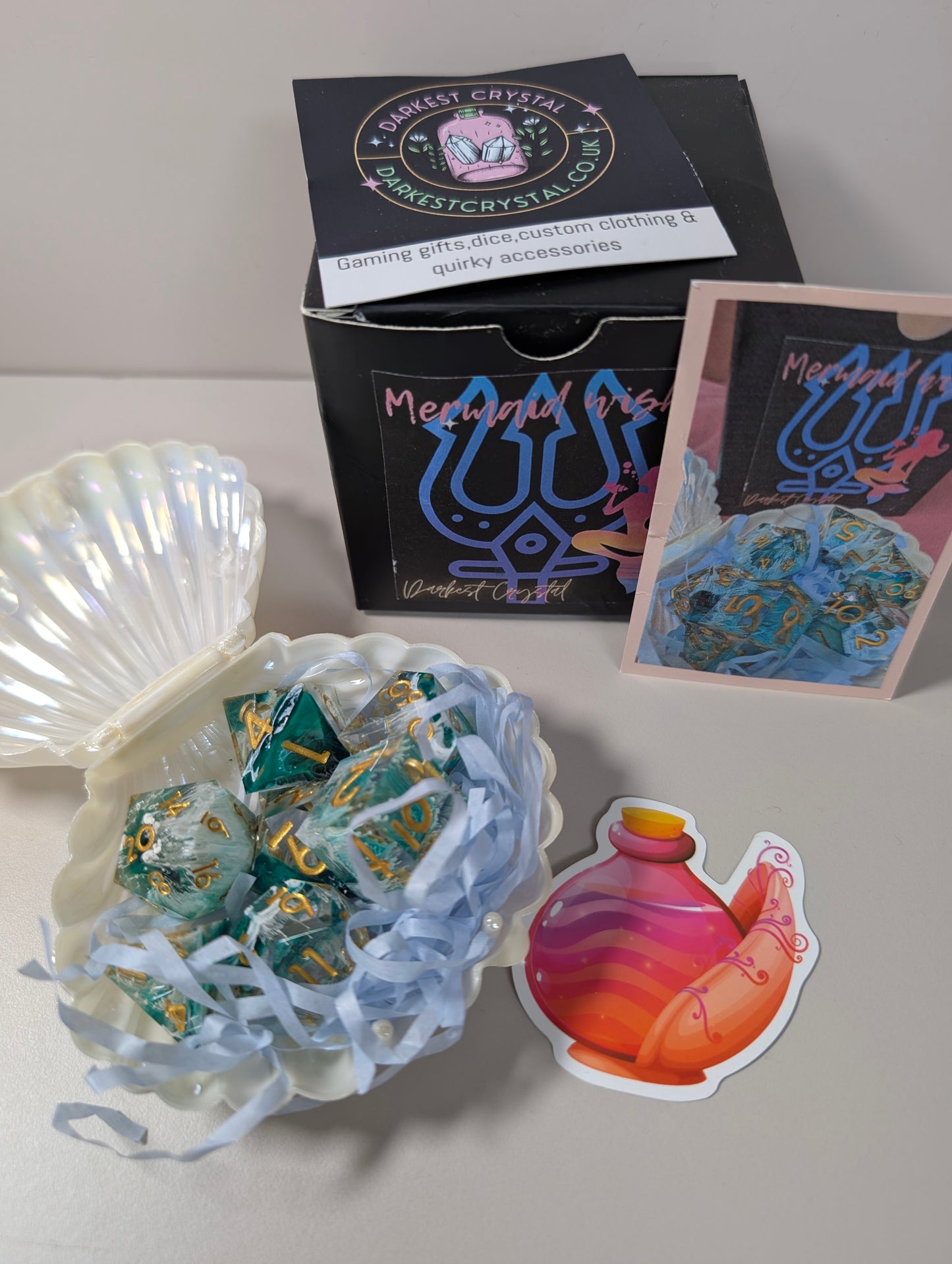 Mermaid wishes ttrpg polyhedral dice gift set, sea waves design in clam shell case