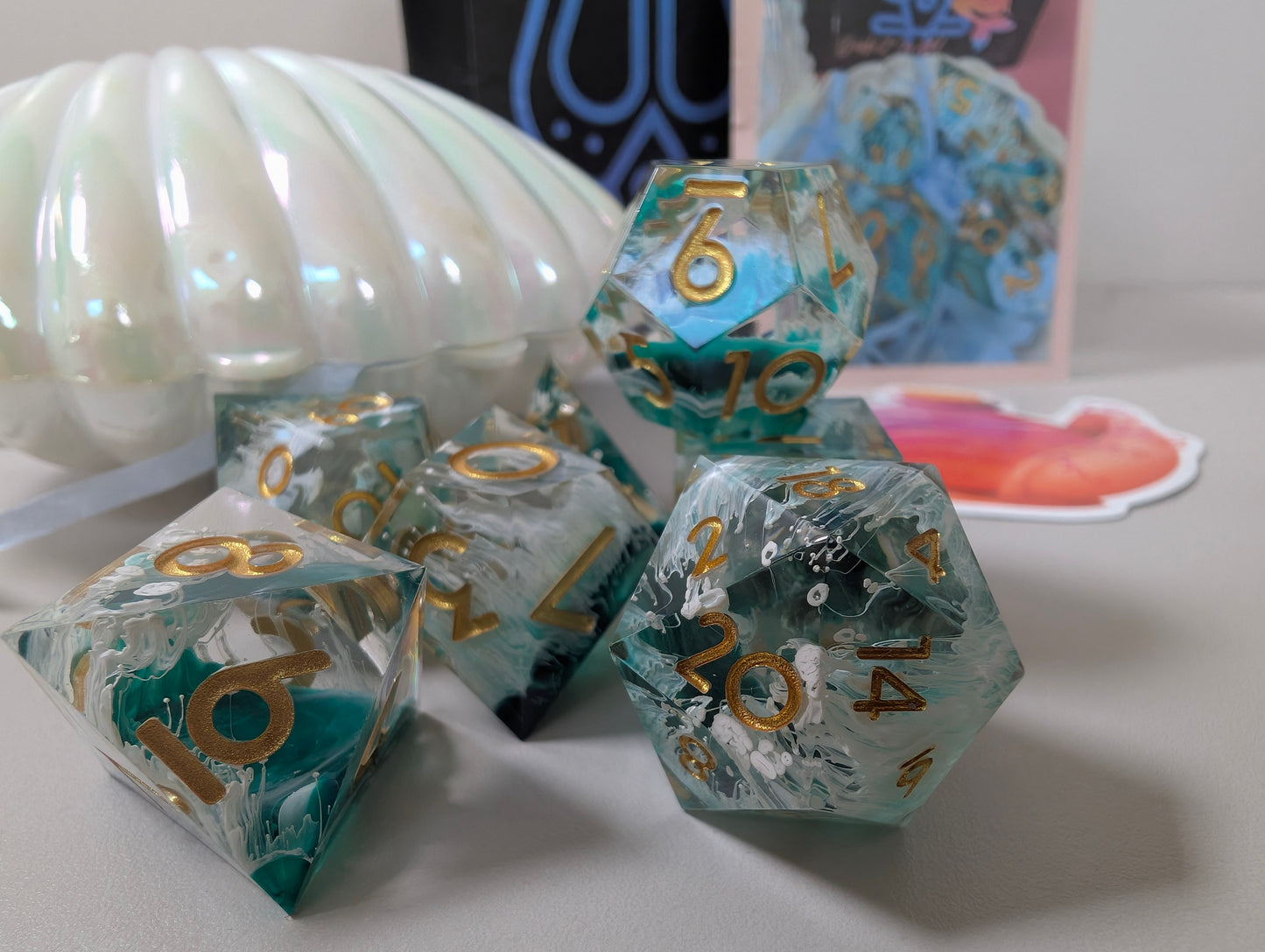 Mermaid wishes ttrpg polyhedral dice gift set, sea waves design in clam shell case